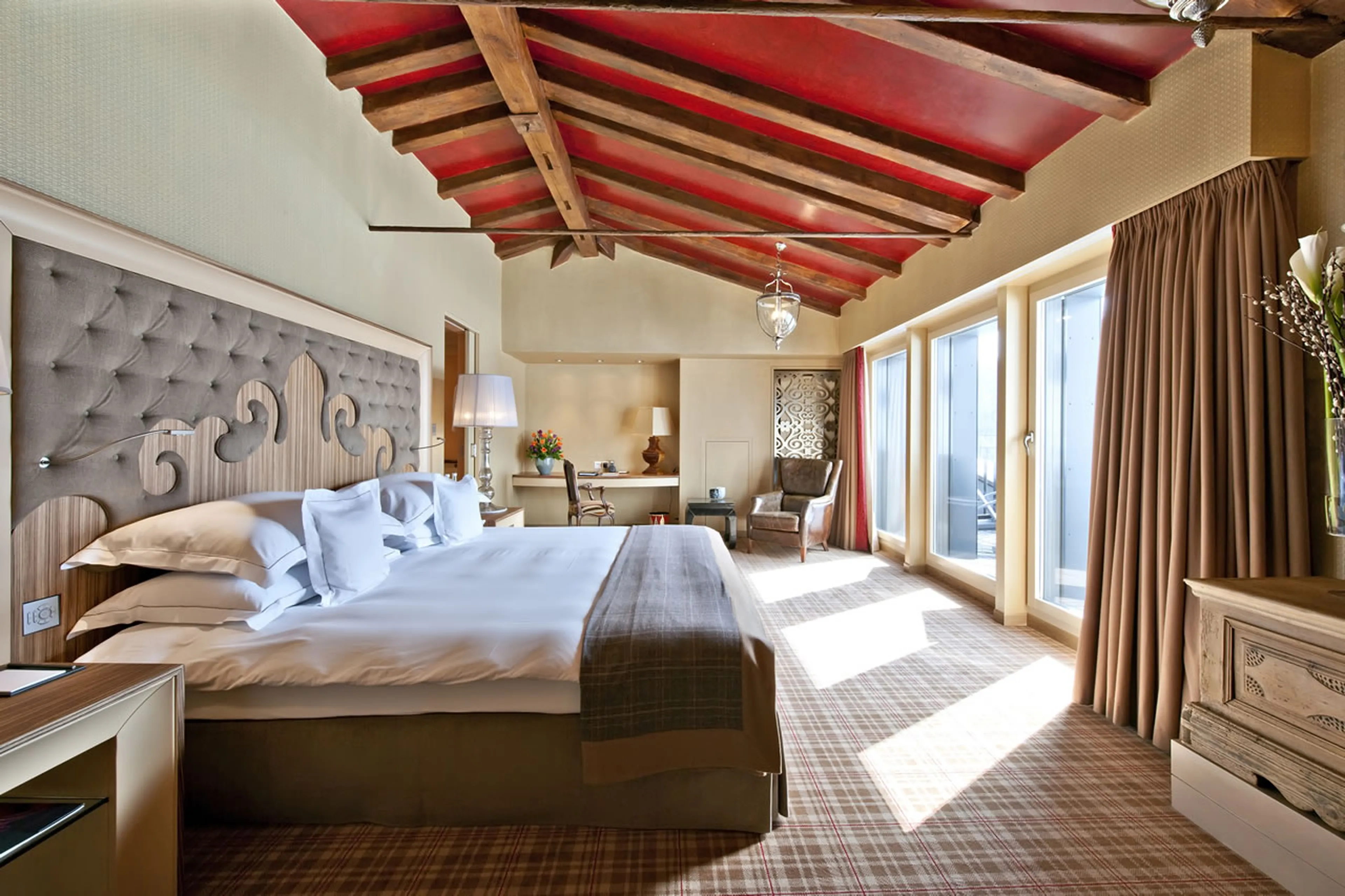 King-size bed in bedroom of The Penthouse in St Moritz