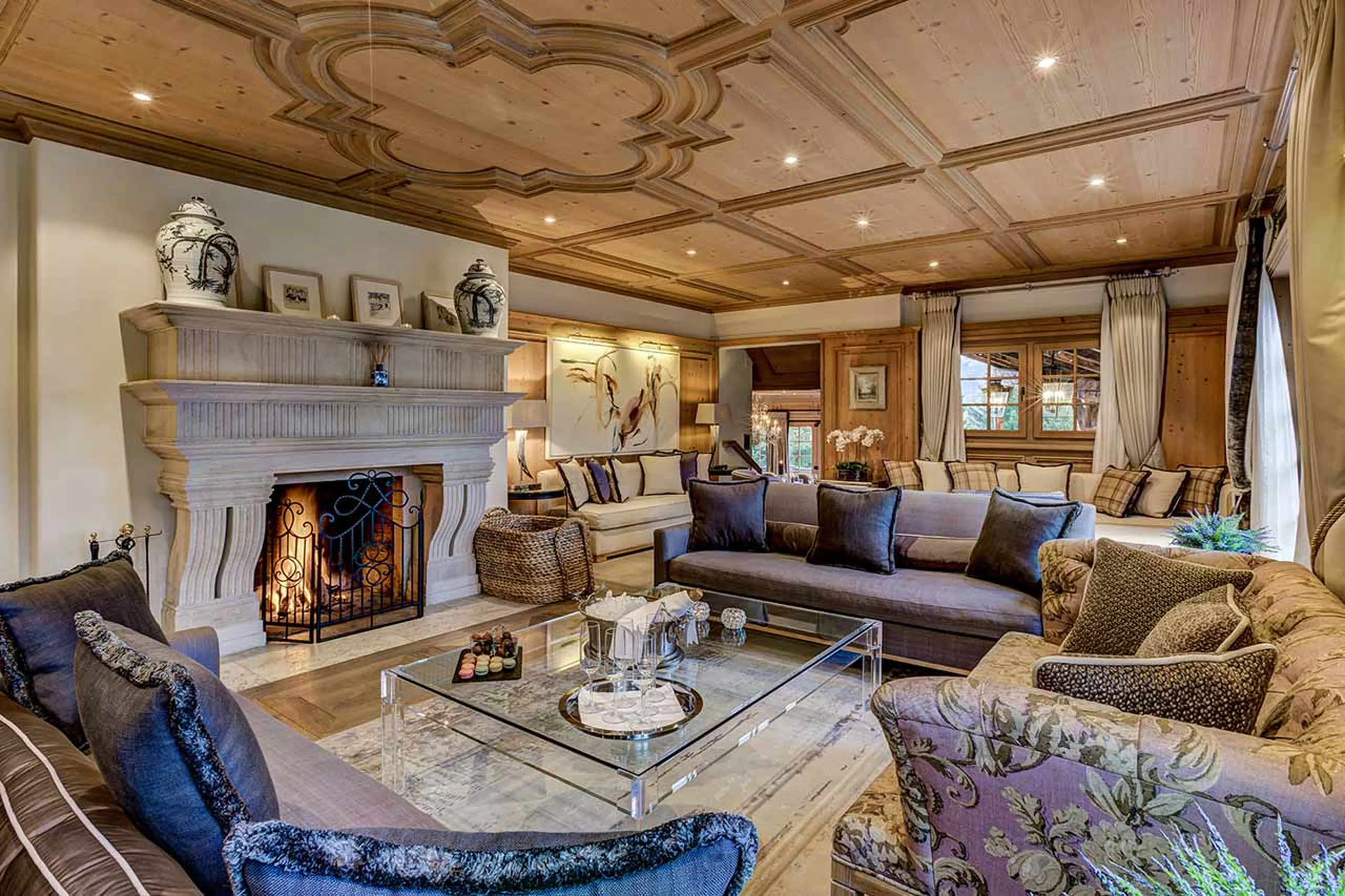 Drawing room with fireplace at Tivoli Lodge in Davos