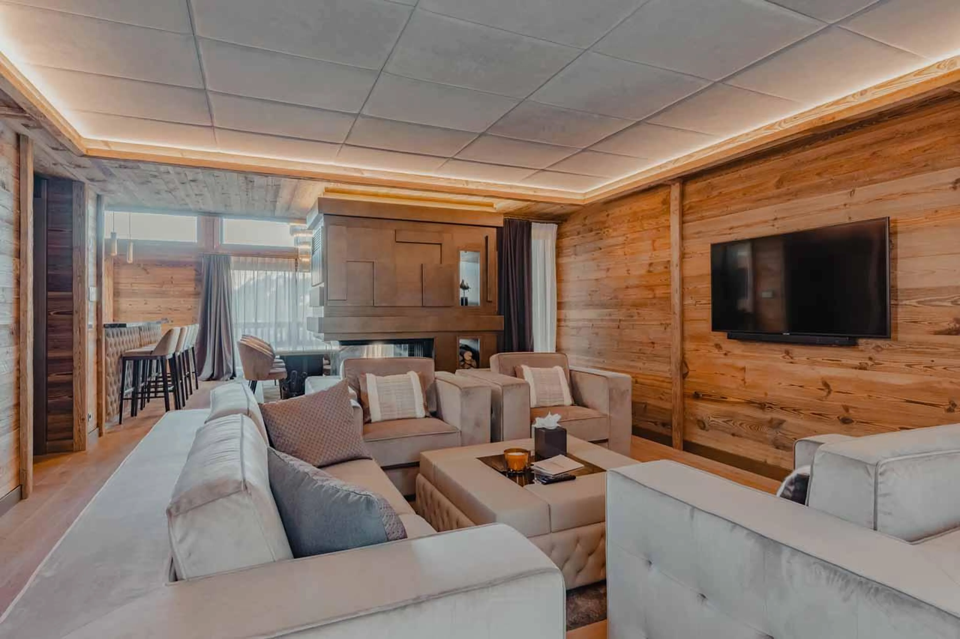 Sofas and armchairs in front of TV at Ultima Courchevel Belvedere in Courchevel 1650