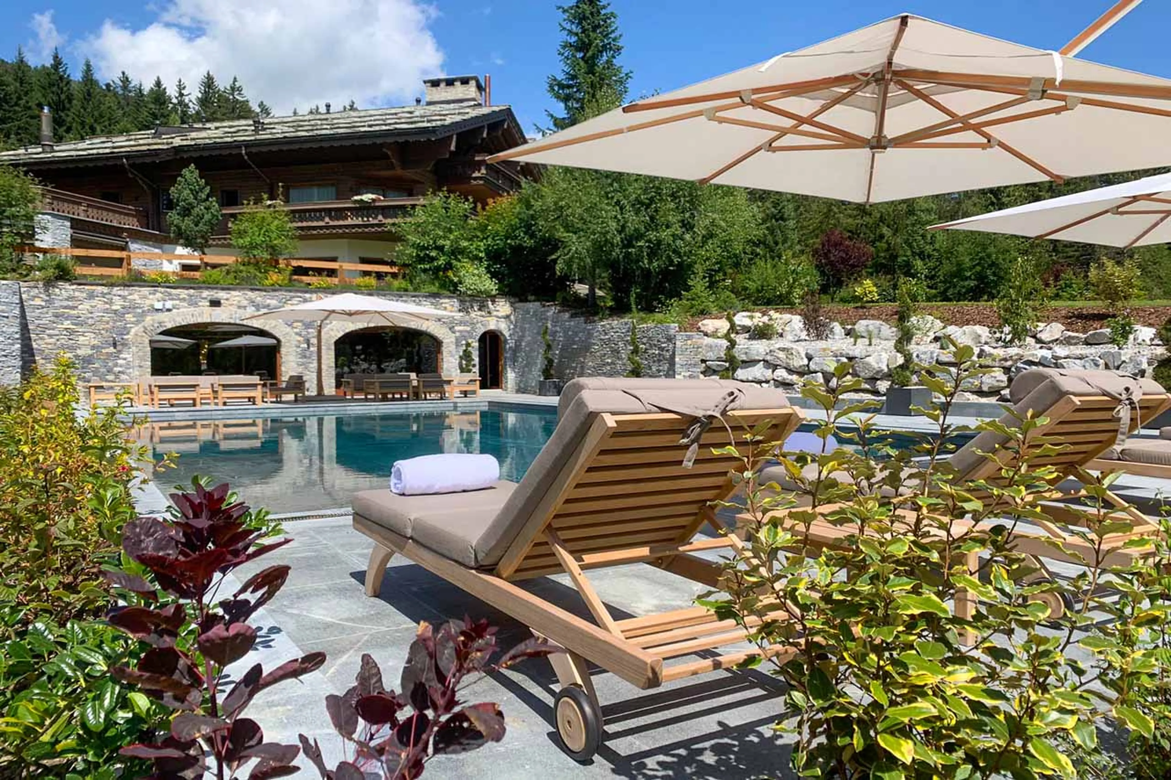 Outdoor pool at Ultima Crans Montana