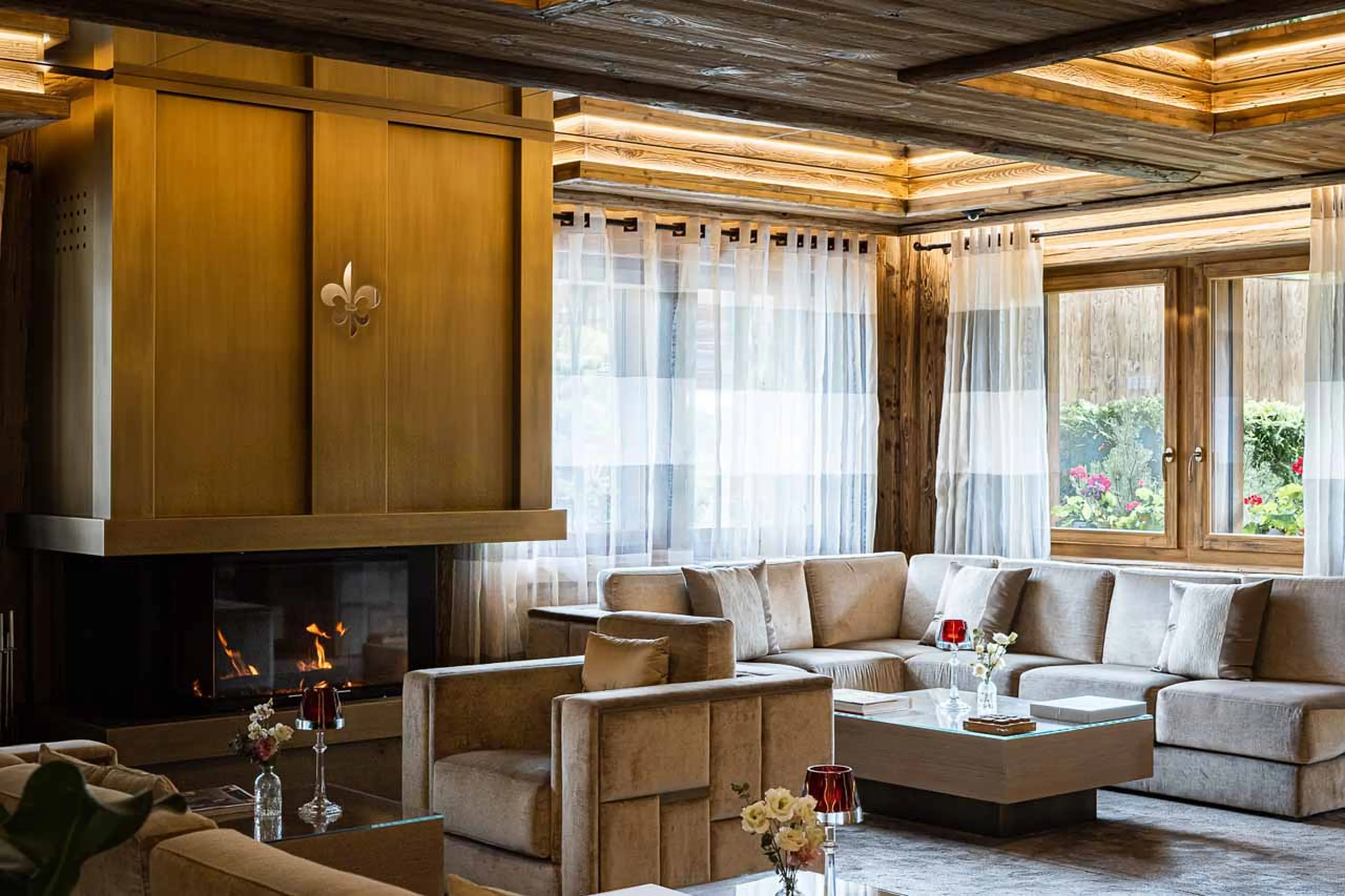 Fireplace in hotel lobby at Ultima Gstaad 4BR Residence in Gstaad