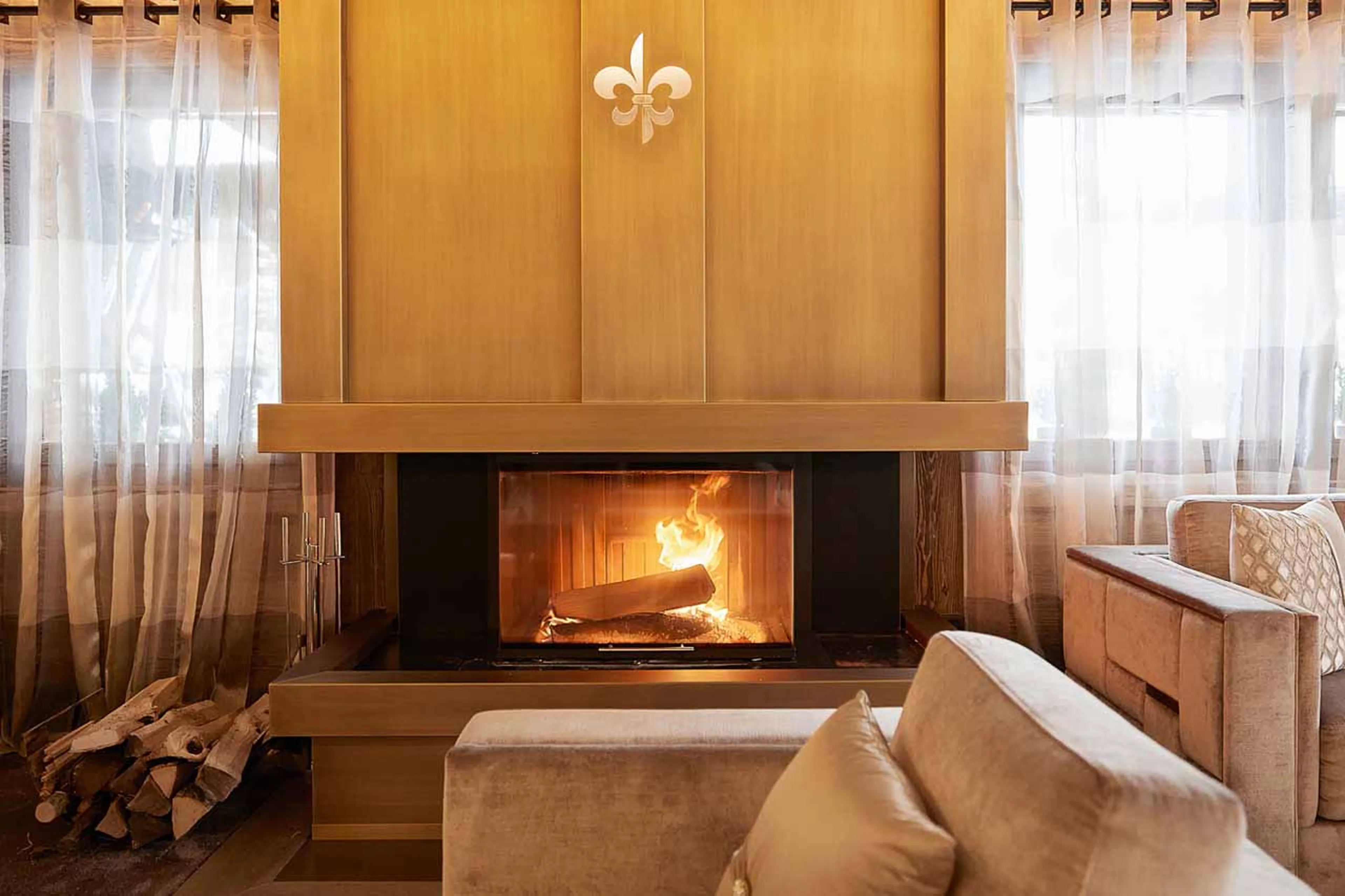 Fireplace in lobby at Ultima Gstaad Residence