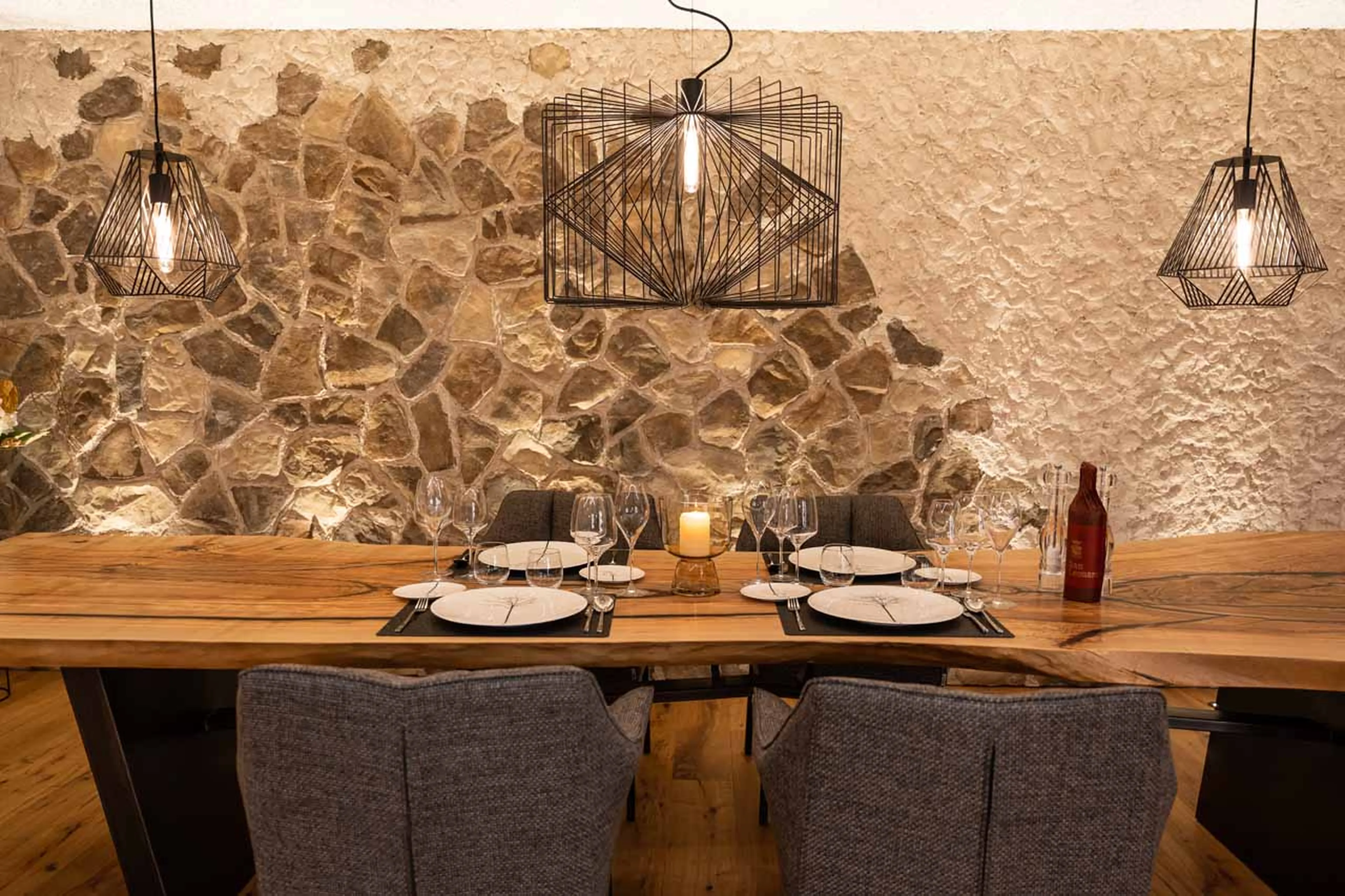 Stone and wood walls at Chalet Carolina in Val Gardena