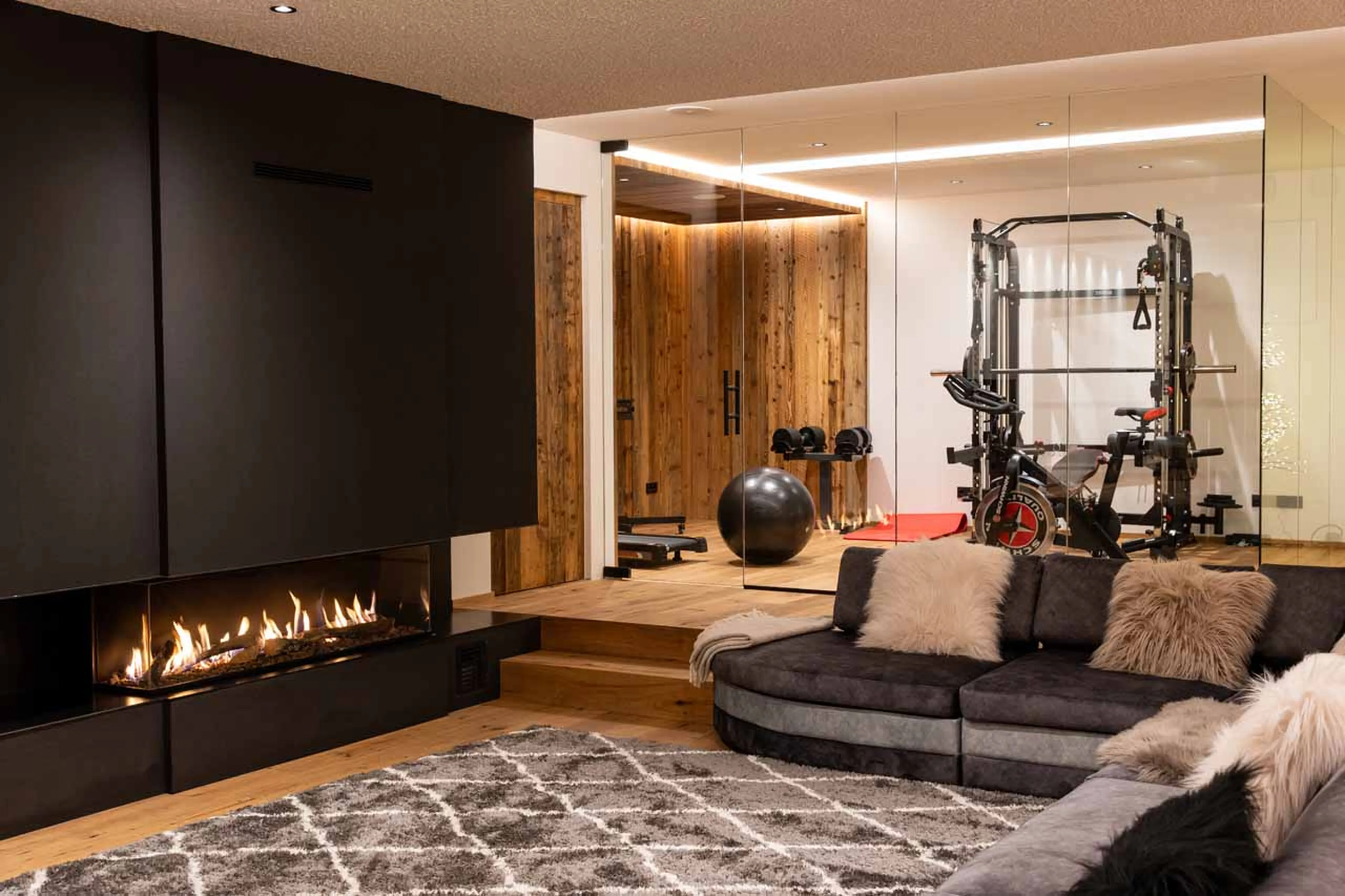 Fireplace and sofas at Chalet Carolina in Val Gardena
