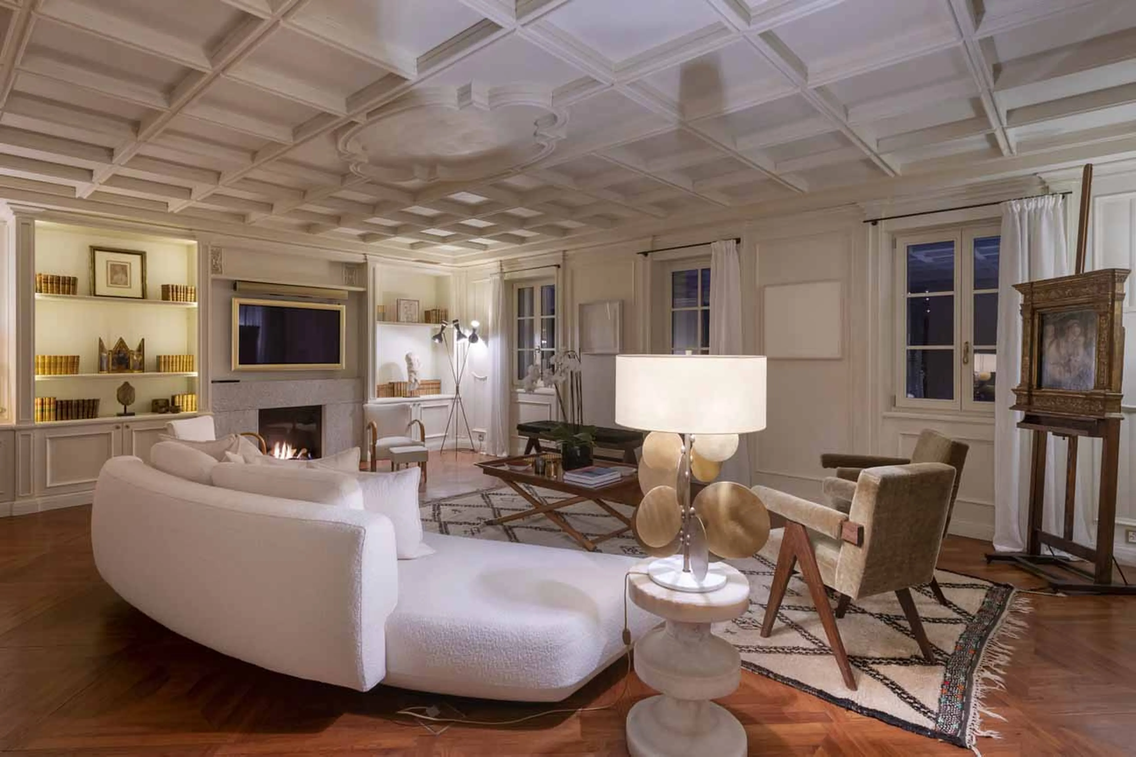 Living area with sofa at night in Villa Erica 2, St Moritz