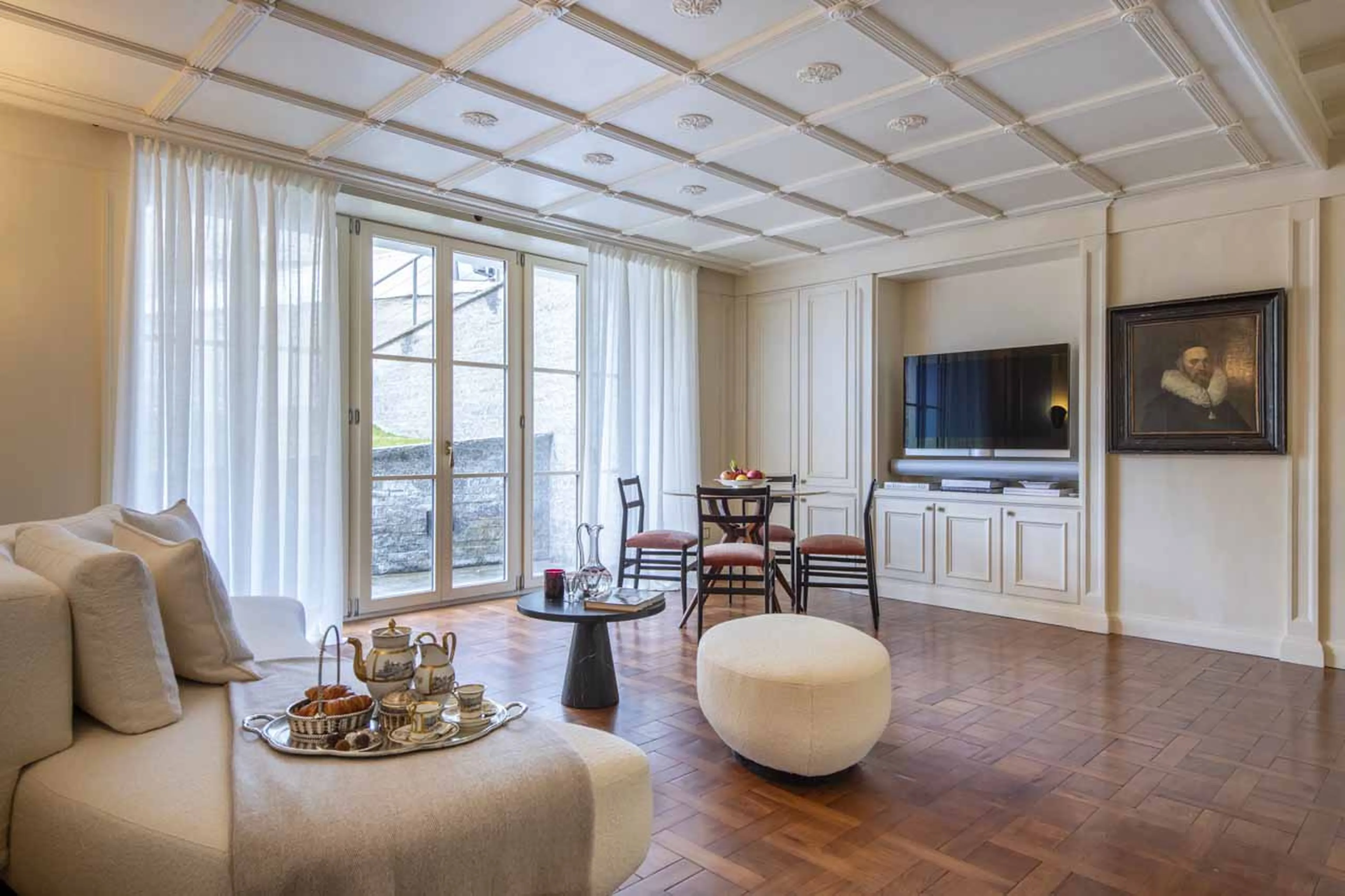 Sofa in front of TV in Villa Erica 1, St Moritz