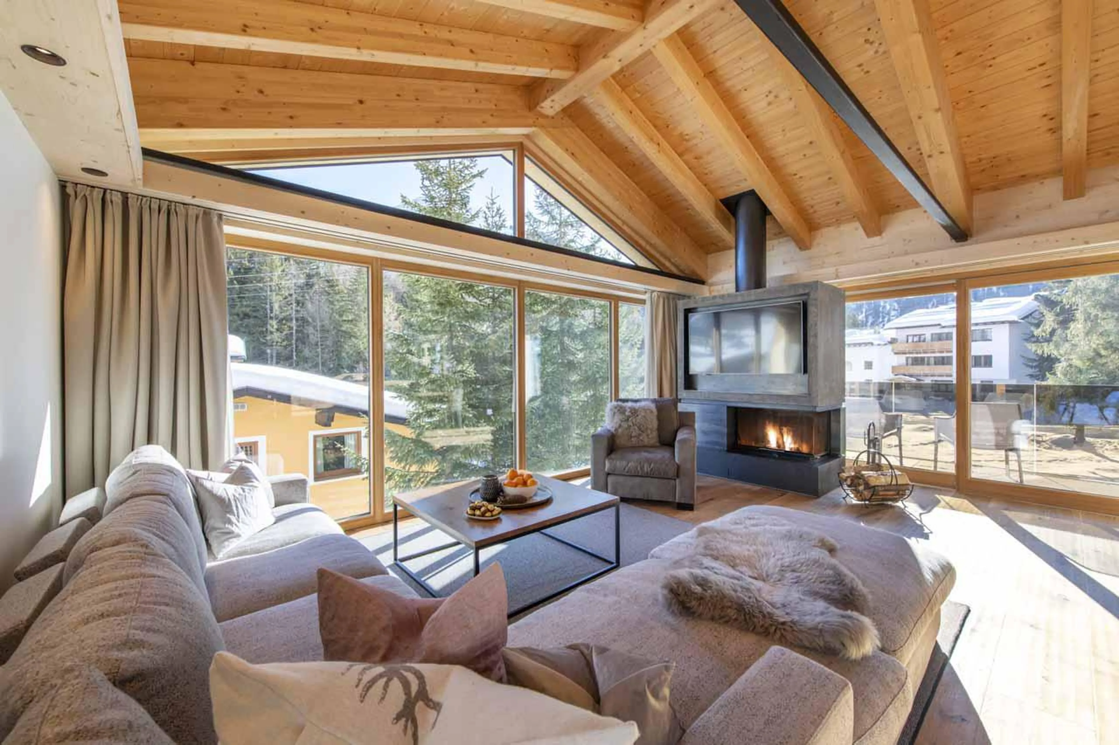 Wood fireplace in living room of Villa Villekulla in St Anton