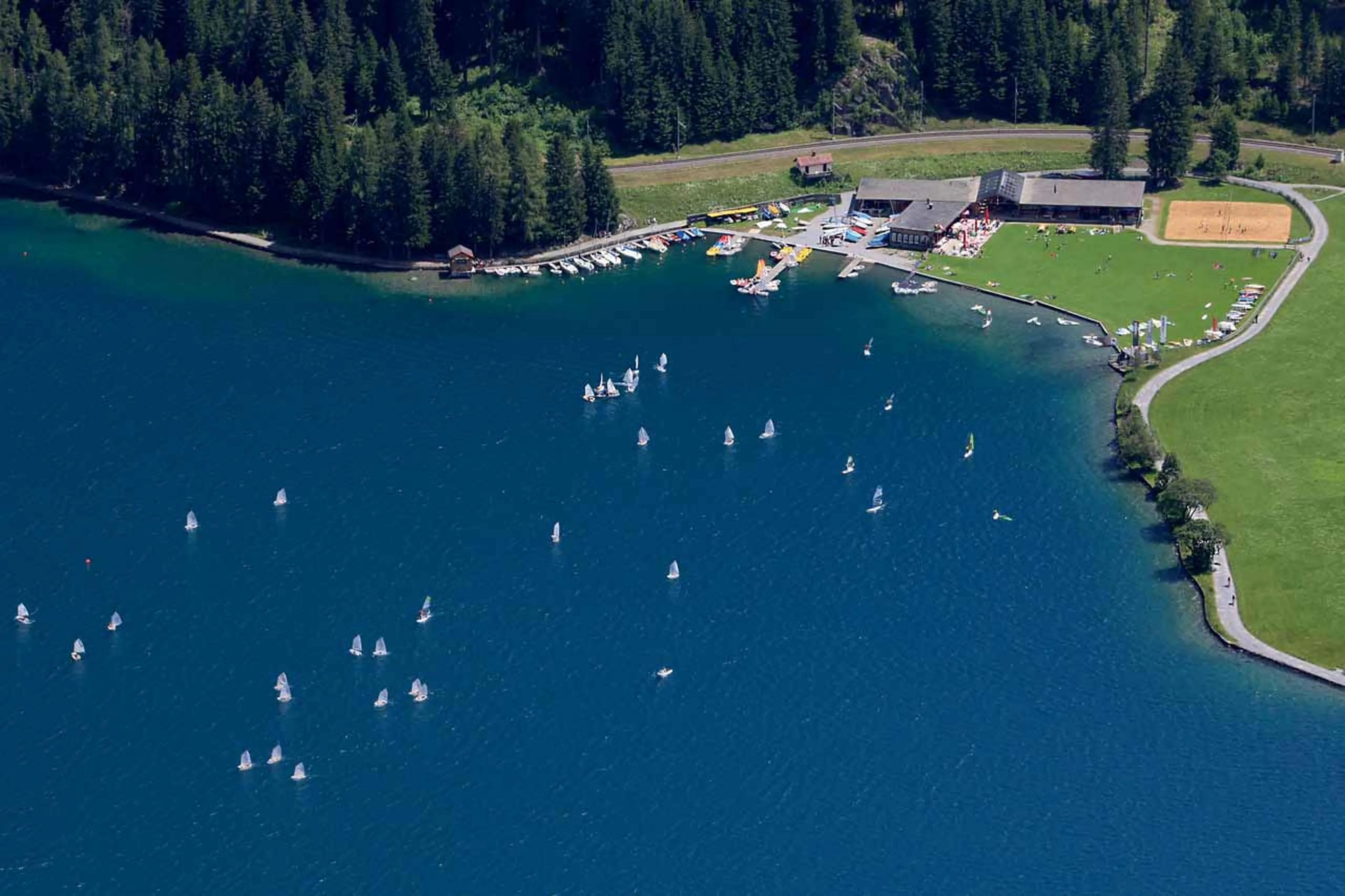 Aerial view of water sports on Lake Davos in summer