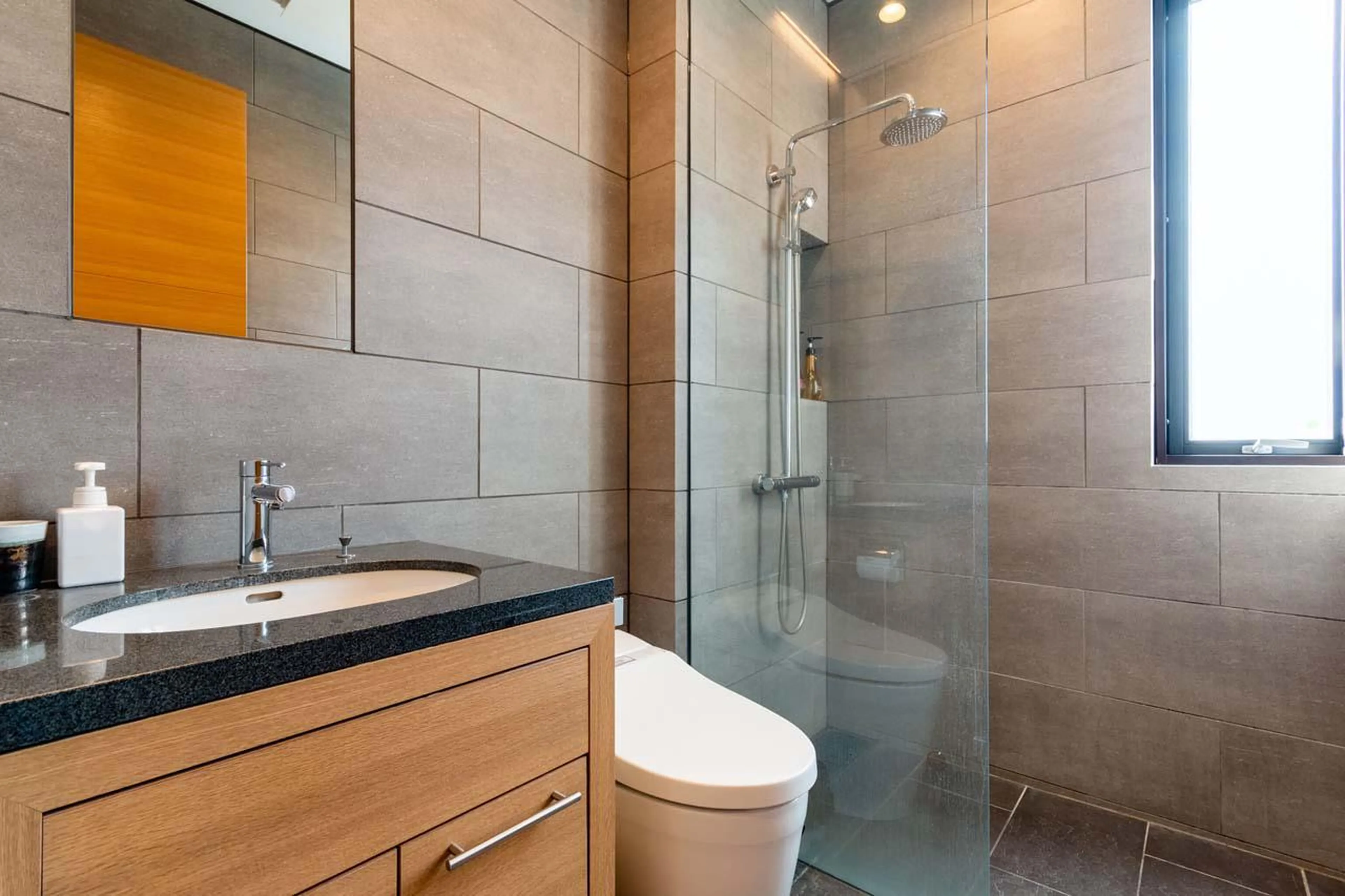 Shower room shared between bedroom three and four at Yanagi House in Niseko